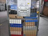 a metal cart with boxes on it in a warehouse
