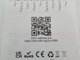 an image of a close up of a piece of paper with a qr code on it
