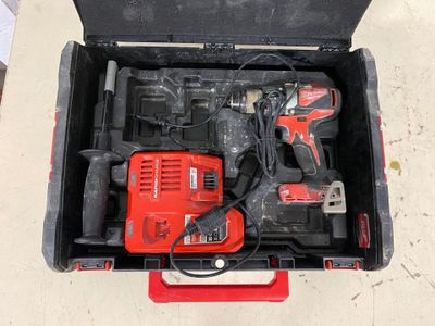 a tool box with two tools in it on the floor