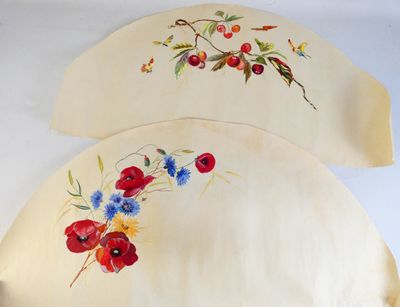 two pieces of cloth with flowers painted on them