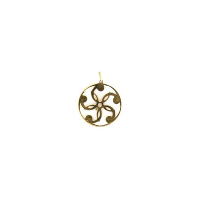 a close up of a gold pendant on a white background