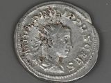 a close up of a silver coin with a woman ' s head on it