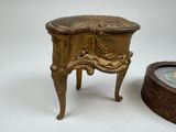 a small table with a clock on top of it