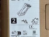 a cardboard box with a pair of scissors in it