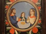 une image représentant un tableau où l'on voit une famille assise à table