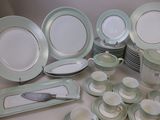 a lot of plates and cups on the table