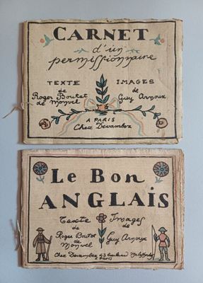 two old french linen labels on a blue wall