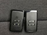 two remote controls on the back of a car seat