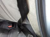a seat belt that is attached to the back of a car