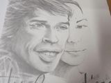 a drawing of a man and a woman on a piece of paper