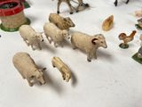 a lot of small figurines of animals on a table