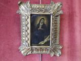 a picture of a picture of a woman in a gold frame