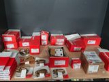 a lot of red boxes on a wooden table