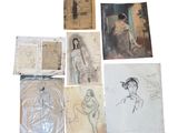some drawings and pictures of a woman are on a white surface