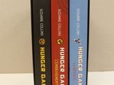 three books are stacked on top of each other on a table