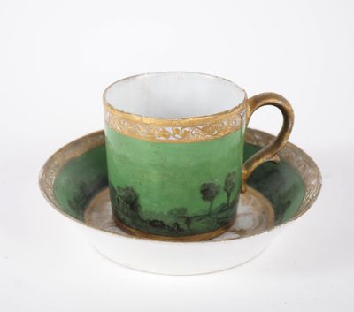 a cup and saucer sitting on a saucer