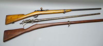 three different types of guns are displayed on a white surface