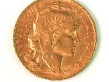 an image of a gold coin with a woman ' s head on it