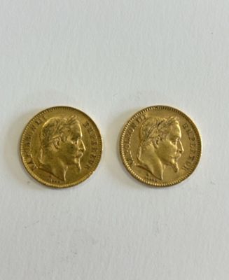 two pieces of gold coin with a woman ' s face and a man ' s head