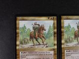 two cards that have a picture of a man on a horse