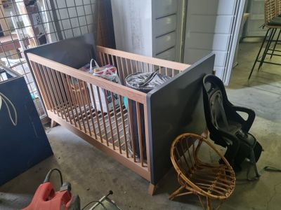 a crib that is sitting in a garage
