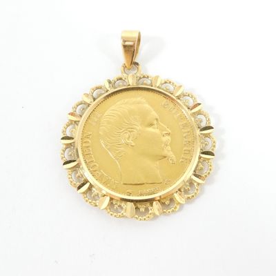 an image of a gold coin pendant with a woman ' s face