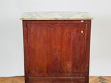 an old wooden cabinet with marble top sitting on a parquet floor