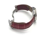 wrist watch with red leather strap on white background