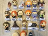 a lot of harry potter figurines on the table