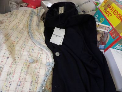 a pile of clothing that is sitting on a table