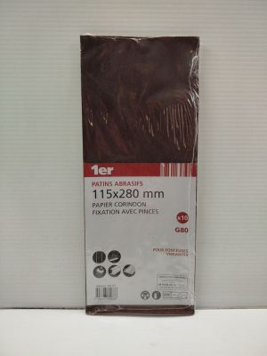 a close up of a package of brown plastic sheets on a white surface