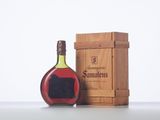 an image of a bottle of wine sitting next to a wooden box