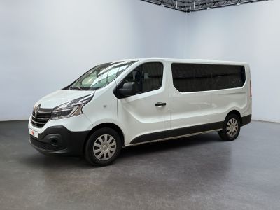 the white van is parked in a large room with white walls