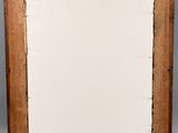 a close up of a picture frame with a piece of paper in it
