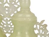 two vases sitting next to each other on a table
