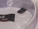 a white shirt wrapped in plastic on a table