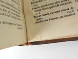 an open book that has a picture of a cat on it