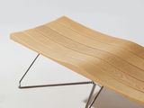 a wooden bench with metal legs on a white background