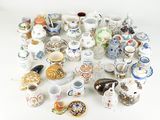 many different types of vases and bowls on the table