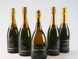a group of bottles of champagne sitting on top of a table