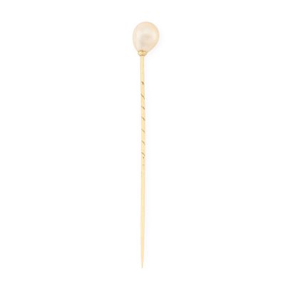 a close up of a stick with a pearl on it