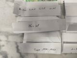 several pieces of paper with writing on them sitting on a table