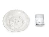 a white plate and a glass on a white table