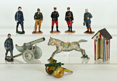 many figurines of men in military uniforms on display