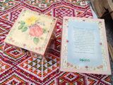 a small table with a book on it on a rug