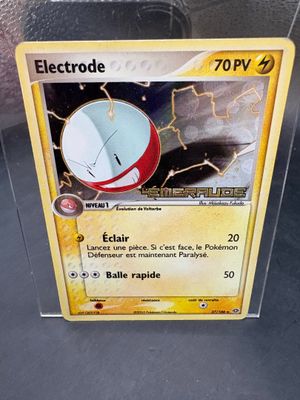 a close up of a pokemon card with a clock on it