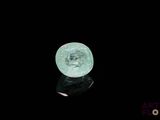 an image of a green crystal ball on a black surface