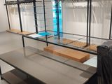 an image of a clothing store with clothes hanging on racks