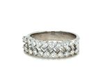 a close up of a diamond ring on a white background