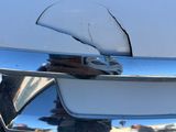 a close up of a car door handle with a broken handle